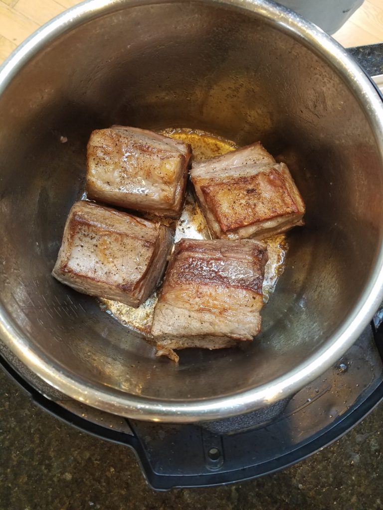 Short ribs cooked on one side.